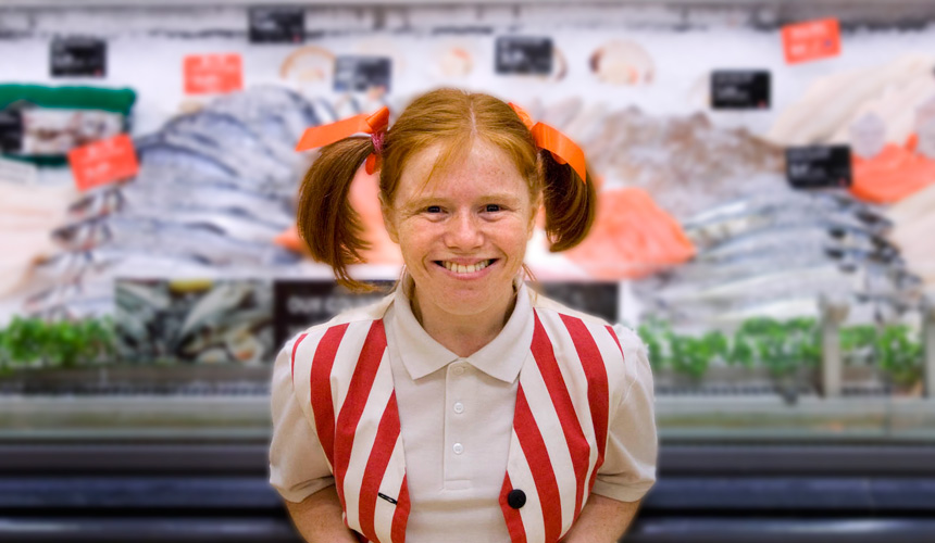 Picture of a woman dressed as a pirate in front of a fish counter