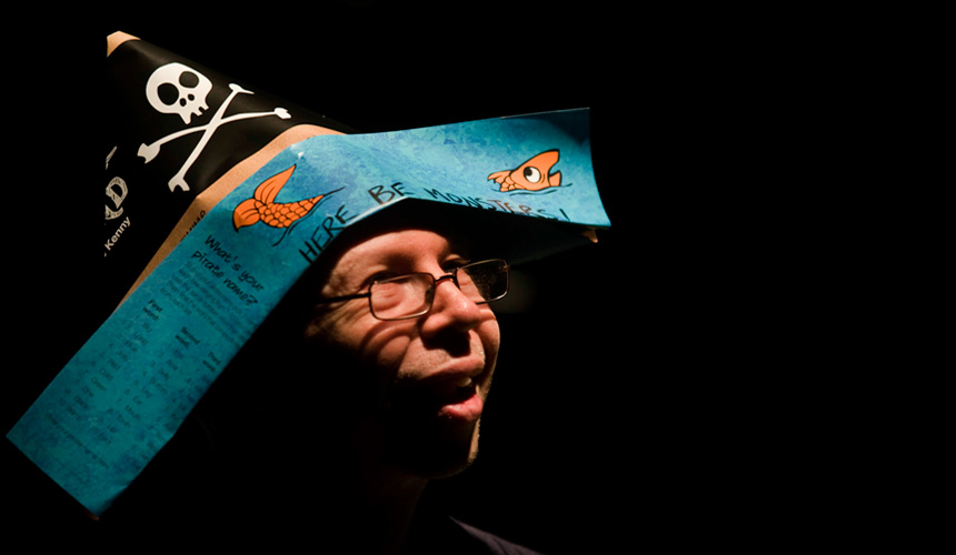 Picture of a man wearing a pirate hat made out of the show programme