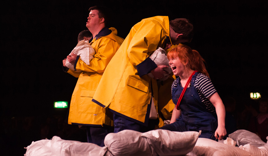 a girl looking fierce with upset looking men in the background